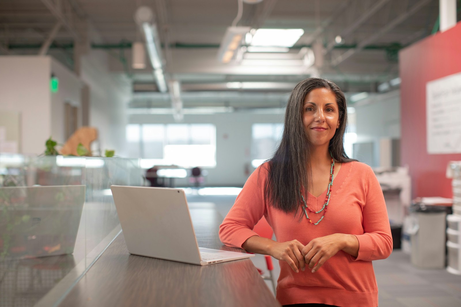 Customer support specialists resolving tickets in a modern operations room