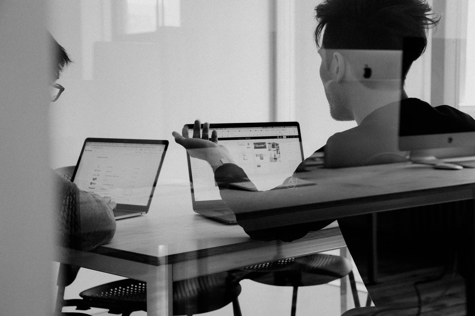 Founders cutting an MVP scope down on a whiteboard during a planning session