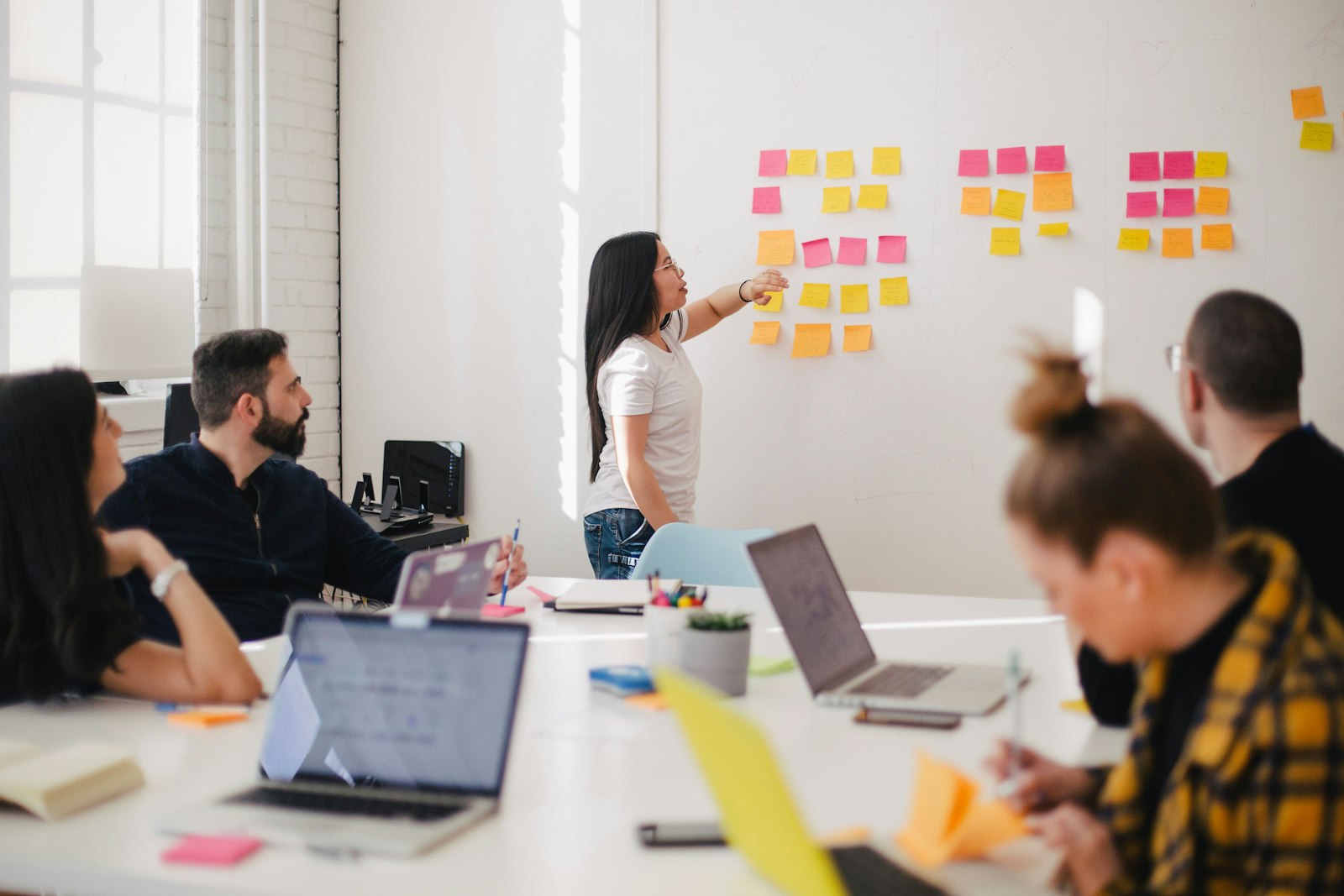 Product team running a sprint planning session with sticky notes
